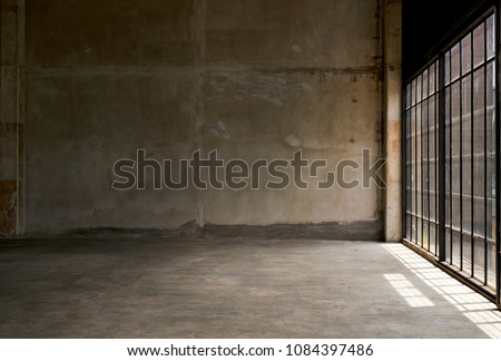 Empty room with large windows and sunlight, Grungy room with light and shadow on floor, Concrete wall background