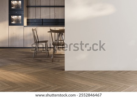 Empty room with minimalist chevron-patterned flooring, featuring a partial view of a wooden kitchen in the background.