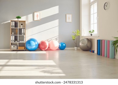 Empty room or office space designed for rehabilitation with various equipment in a rehabilitation center or physiotherapy clinic, suitable for physical therapy and sports medicine. - Powered by Shutterstock