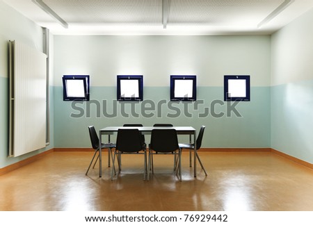 empty room with one table and chairs