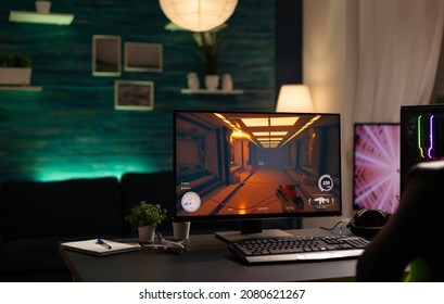 Empty Room With Online Video Games On Computer To Play With Controller. Nobody At Desk With Digital Game On Monitor, Modern Gaming Equipment And Device To Have Leisure Activity.