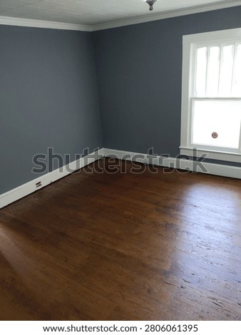 empty room recently painted recently refinished wooden floors