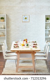 Empty Room With Served Thanksgiving Table And Six Chairs For Guests