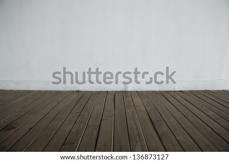 empty room  with white wall and wood floor background.