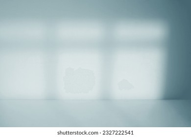 Empty room with window shadow
