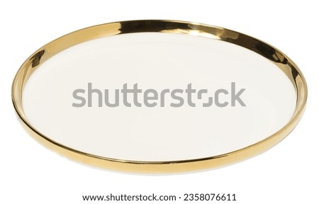 Empty round ceramic white plate with a gilded edge on a white isolated background. Crockery at an angle