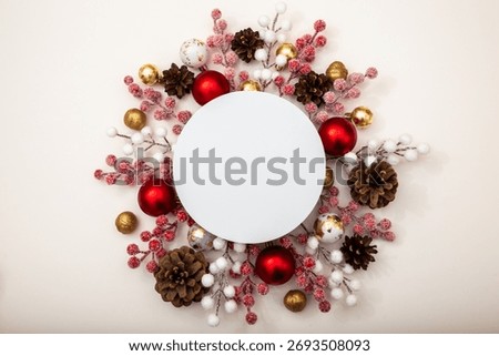 Empty round mockup in a Christmas composition with baubles, pinecones and berries. Space for logo, text or holiday message