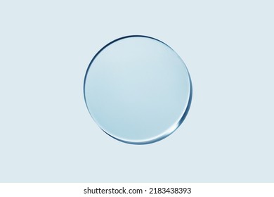 Empty round petri dish or glass slide on blue background. Mockup for cosmetic or scientific product sample - Shutterstock ID 2183438393