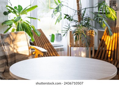 Empty round table for installation and demonstration of product in interior with Tropical indoor plants in country green house . Houseplant Growing and caring for potted plant, greenhome in cottage