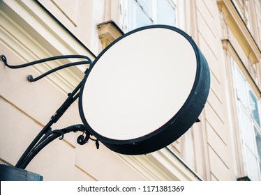 Empty Round White Signage On Building With Classical Architecture And Daylight. Mock Up 