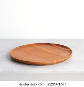 Empty Round Wooden Plate On Gray Cement Table Background, Banner With Copy Space, Blank Wood Tray For Food Display Montage, Template, Mock Up, Top View, Flat Lay