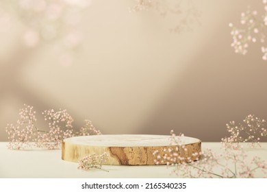 Empty round wooden podium for product presentation, pink gypsophila flowers on beige background. Natural materials background for cosmetic advertising with cylinder shape showcase. Mockup concept. - Shutterstock ID 2165340235