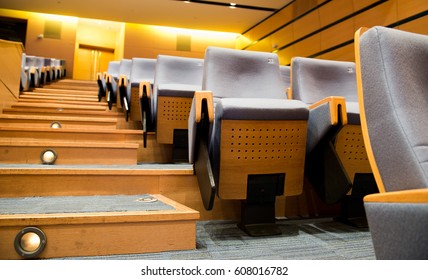 Empty rows of chairs in theater.