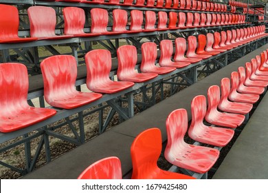 Empty Rows With Red  Seats On A Football Arena. 