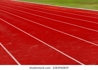Empty running track in stadium. Close up of athlete track or jogging track in university or college campus and building.