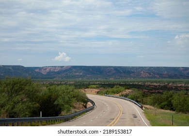 Empty Rural Highway Landscape On A Road Trip In Texas On A Summer Vacation Car Trip.  Feelings Of Possibility, Hope, New Adventures, And A Road Ahead Inspire Ideas.