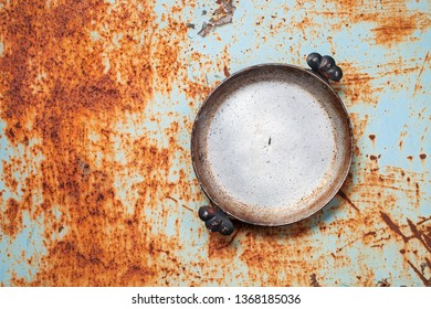 Empty Rusted Cast Iron Pan On Rust Background. Top View. Copy Space