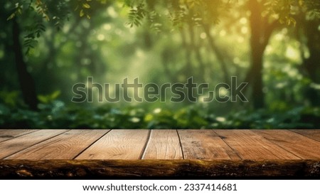 The empty rustic wooden plank table top with blur background of jungle. Exuberant image.