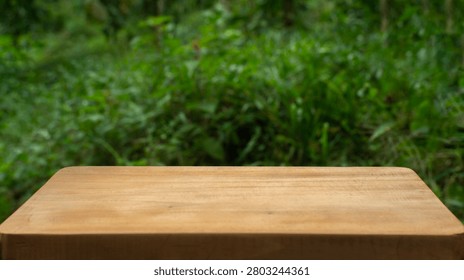 Empty Rustic Wooden Table with Green Blurred Nature Background