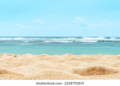 Empty sandy beach in the background with a blurry summer sea.  - Powered by Shutterstock