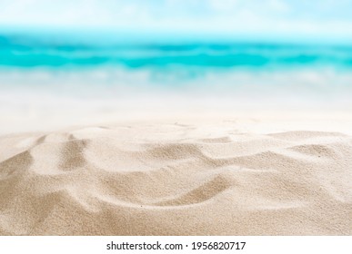 Empty sandy beach. Little shells in the sand. Splashing waves on the seashore. Summer. - Powered by Shutterstock