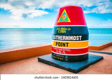 Empty scenic view of the colorful concrete buoy featuring the municipal seal of Key West marking the southernmost point of the continental USA in Florida