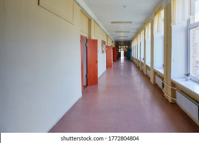 An Empty School Corridor Stretching Into The Future. The Concept Of Holidays, Quarantine, Evacuation