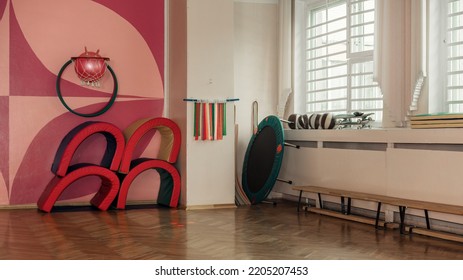 Empty School Gym With Sports Equipment And Wooden Floor. Interior Of Sport Hall In Playschool.