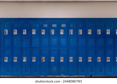 Empty school hallway with blue metal student lockers	 - Powered by Shutterstock