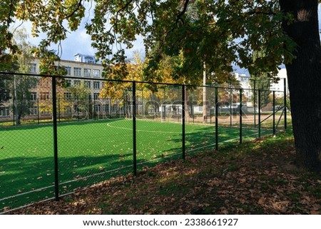 Empty school soccer stadium in autumn
