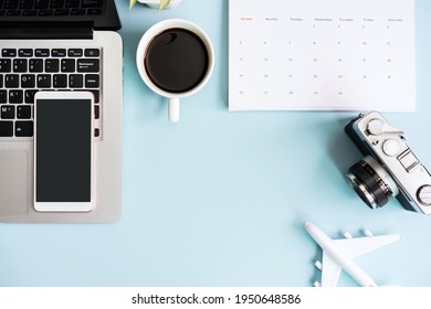 Empty screen smart phone and computer with travel items on color background with copy space, Vacation planning concept