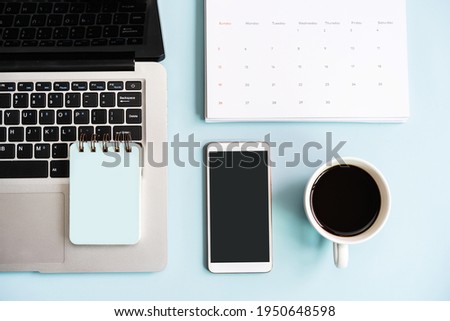 Empty screen smart phone and computer with travel items on color background with copy space, Vacation planning concept