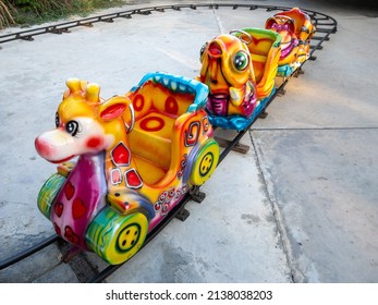 The Empty Seat Of The Colorful Animal Train For The Kid In The Theme Park Of The Festival, Front View For The Copy Space.