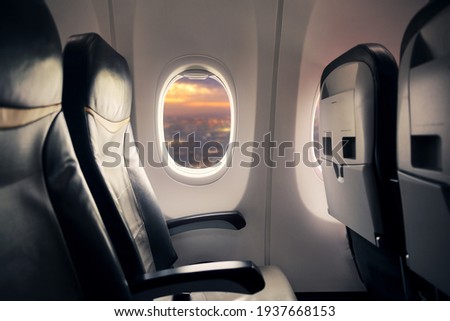 Empty seat on airplane while covid-19 outbreak destroy travel and airline business, health care and travel concept. Focus on window.