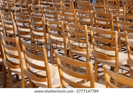 Empty seating arrangement inside hall awaiting visitors or audience