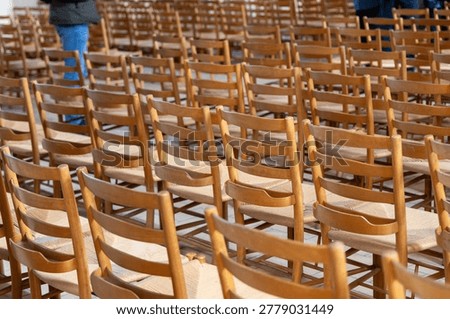Empty seating arrangement inside hall awaiting visitors or audience