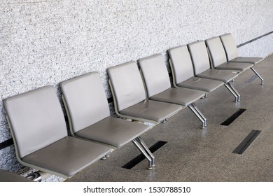 Empty Seats At A Business Building With White Wall, A Row Of Waiting Chairs, Waiting Area With Chair Row In The Office Seating Area Against A Wall