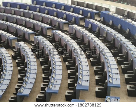 Empty seats in conference hall . blue chairs in european parliament building of european union in strasbourg france 