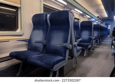 Empty seats inside a second class train wagon
