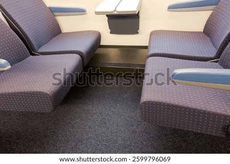 Empty seats inside of Swiss train coach destination Chur at Zürich Hauptbahnhof on a Sunday winter morning. Photo taken March 16th, 2025, Zurich, Switzerland.