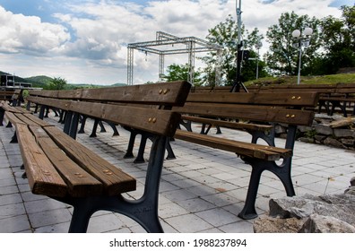 Empty Seats Of An Outdoor Concert Stage With No Audience. Shot At A Dramatic Angle. Sad And Lonely Feeling. No People 