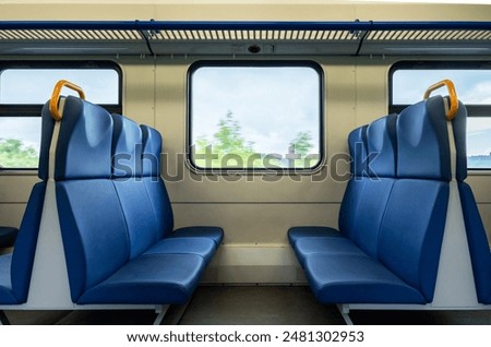 Similar – Image, Stock Photo Passenger train is arrived to railway platform station, people walking in hurry, Sun in backlight