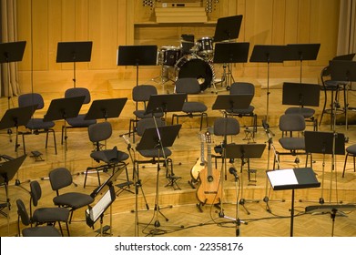 Empty Seats And Some Instruments In Music Hall Awaiting Orchestra To Come On The Stage