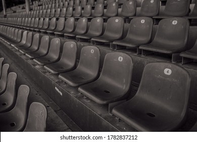 empty seats in a sports stadium black and white photo