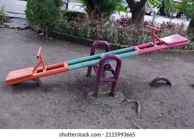 Empty Seesaw On Playground In Public Park. Playground For Kids.