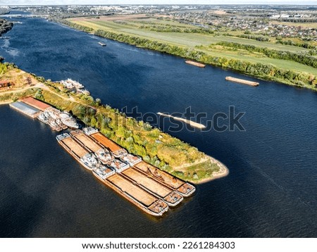 Empty self-propelled barges stand at the pier