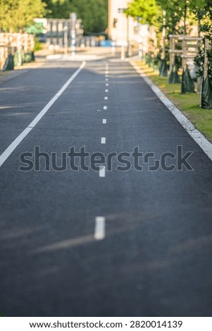 Empty separated bicycle lane through quiet urban area