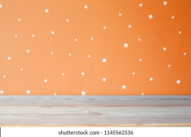 Empty Shelf And Orange Wall In Kids Room