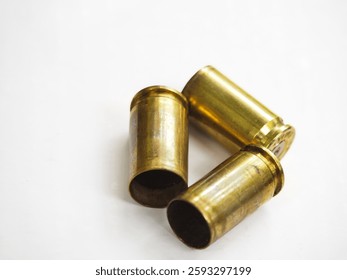 Empty shells of bullet chasing of 9mm caliber pistol on isolated white background.