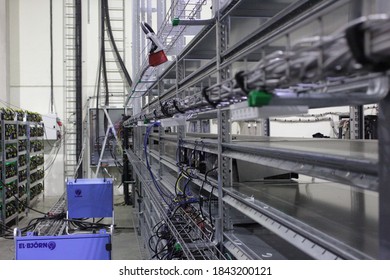 Empty shelving, racks for mining computer, cables on rack